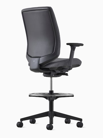 Back angled view of a black Verus Stool with upholstered back.