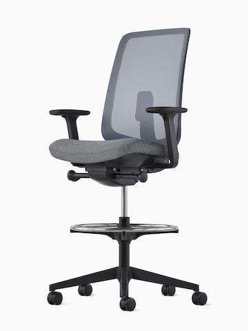 Angled view of a black Verus Stool with suspension back.