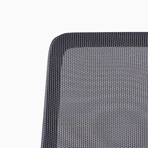A close-up view of a Verus Stool's black suspension back.