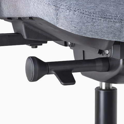 A close-up view of a Verus Stool's black adjustment knob.