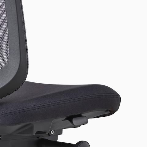 A close-up view of a Verus Stool's black adjustment knob.
