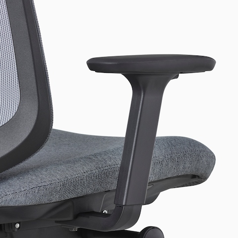 A close-up view of a Verus Stool's black fully-adjustable arms.
