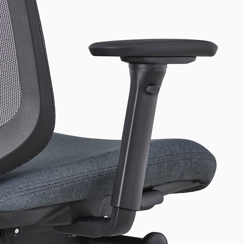 A close-up view of a Verus Stool's black fully-adjustable arms.