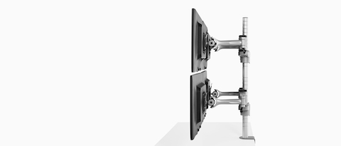 Profile view of four monitors attached to a single Wishbone Monitor Arm post.