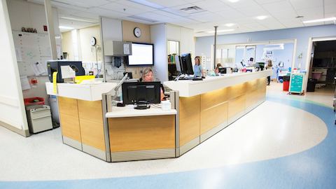 Employees working inside of a medical facility. 