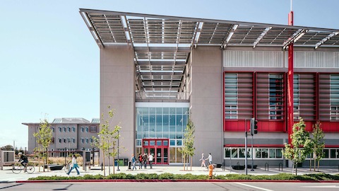 An exterior view of a school with modern architecture during the daytime.