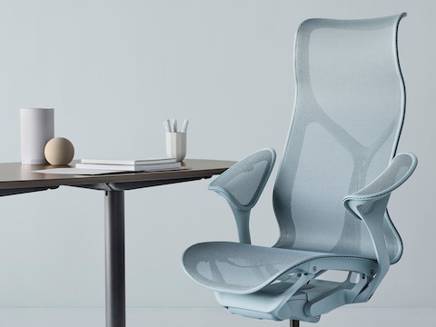 Cosm high back chair in light blue at a table.