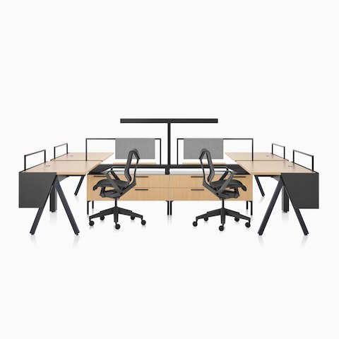 A Canvas Vista workstation with a-shaped legs, modesty screens, a t-shaped light, and black Cosm office chairs.