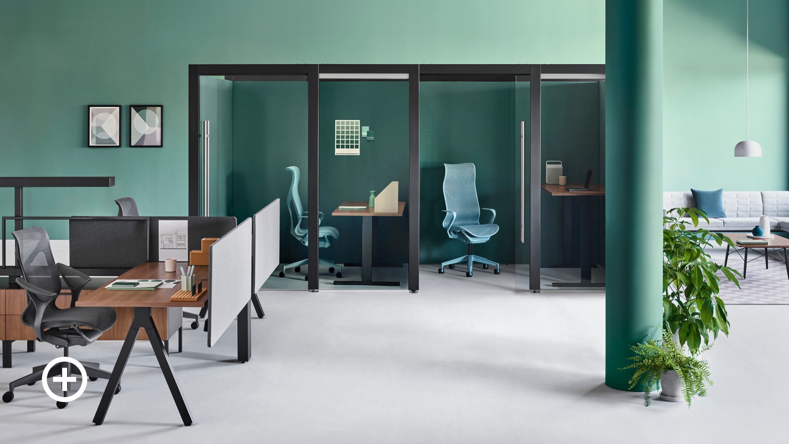 An office setting with two Overlay rooms containing Cosm office chairs and height-adjustable desks and Canvas Vista workstations nearby.
