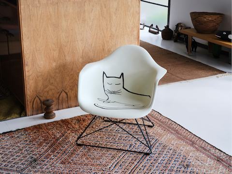 Eames Fiberglass Armchair with Steinberg Cat in the Eames House.