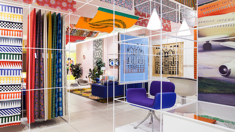 Colorful textiles designed by Alexander Girard hang in a temporay installation in New York City. Select to go to an article about Girard.