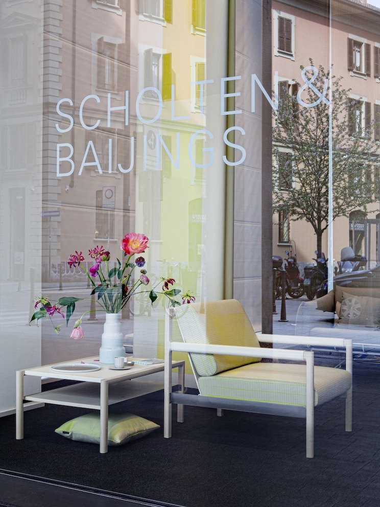 Flowers from Holland, along with tabletop objects designed by Scholten & Baijings, accompany Vincent Van Duysen's Brabo lounge chair upholstered in Grid.