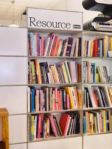 Shelves filled with books at the Lichen location.