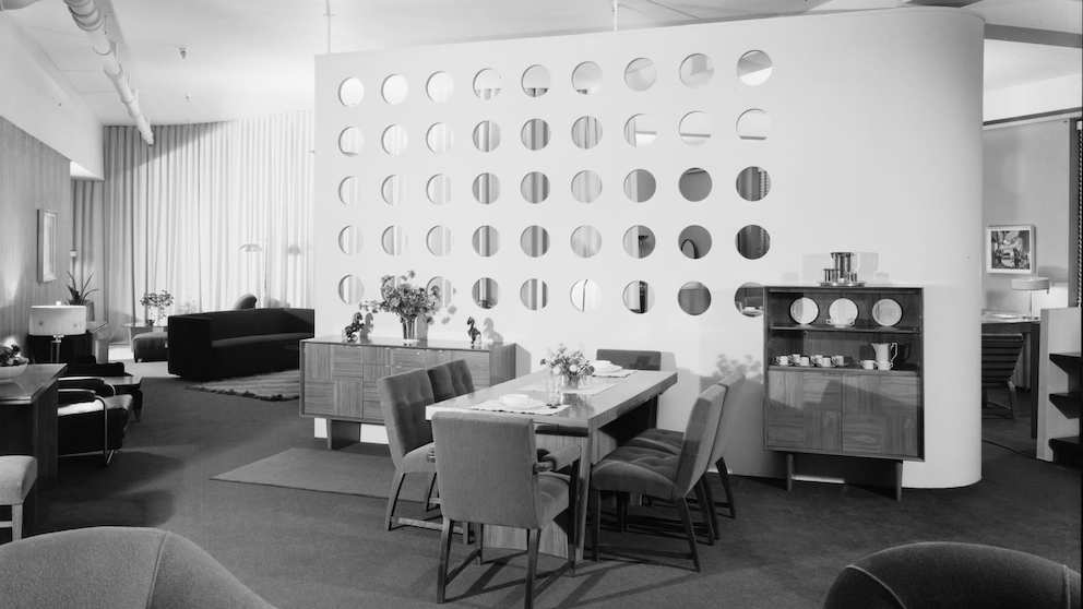 A black and white composition photo of furniture in a 1939 showroom designed by Gilbert Rohde.