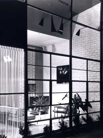 A black and white archival photo featuring the steel-frame structure of Herman Miller’s Los Angeles showroom.