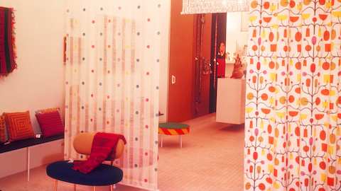An archival photo of Alexander Girard's brightly colored San Francisco showroom for Herman Miller.