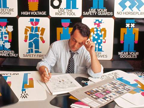 The Pronto Posters originated as safety posters for the Production Line Ride at the Chrysler Pavilion at the 1964-5 World's Fair in New York (Lance Wyman pictured above, 1965). The posters were eventually produced by Howard Miller and marketed as safety signage for factories.